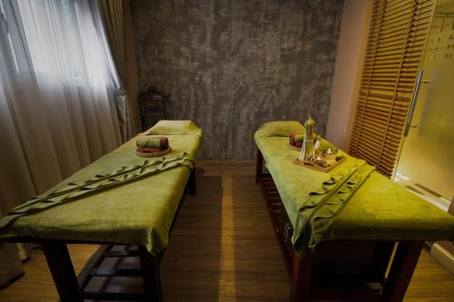 a hospital room with two beds and a window at Hanoi Brilliant Hotel & Spa in Hanoi
