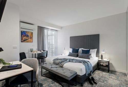 Ένα ή περισσότερα κρεβάτια σε δωμάτιο στο Punthill South Yarra Grand