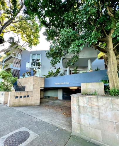 a building with a blue and white building at Bondi View room-Close to the Beach in Sydney