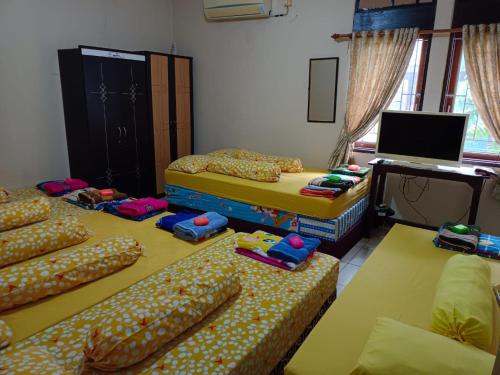 Katil atau katil-katil dalam bilik di Ray Executive Guesthouse Rooms