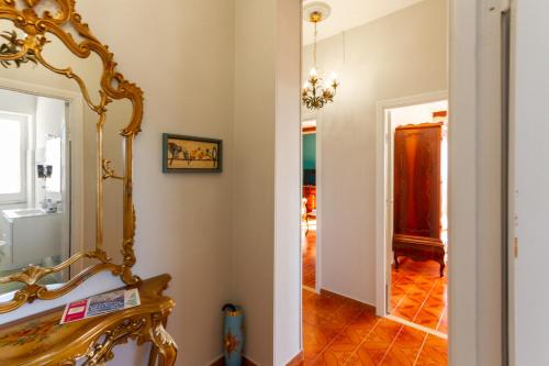 a hallway with a mirror next to a room at Carloforte Appartamento con Vista IUN R2015 in Carloforte