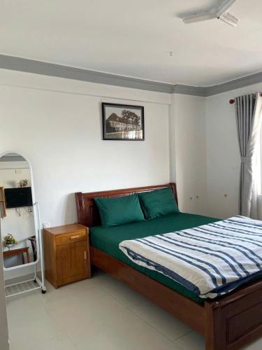 Giường trong phòng chung tại NT Homestay