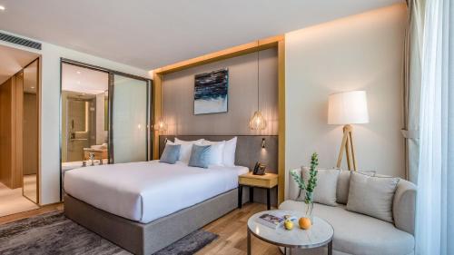 Postel nebo postele na pokoji v ubytování Sel de Mer Hotel & Suites
