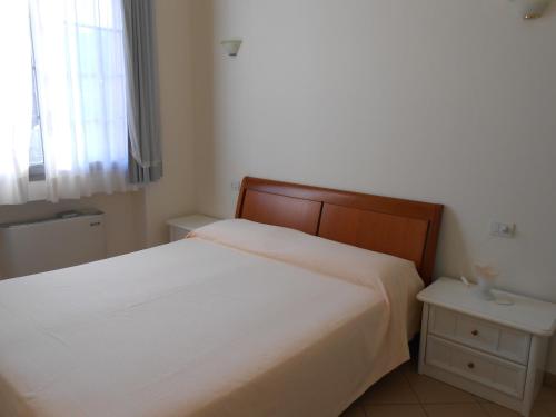 Giường trong phòng chung tại Residence Villa Marina