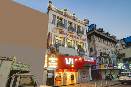a building with a sign on the side of it at Shyama inn by Rivlet in New Delhi