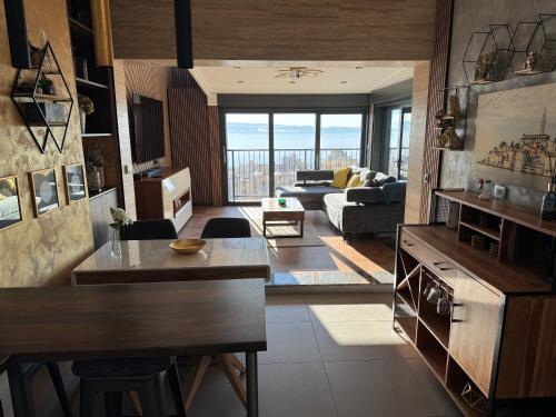a living room with a view of a living room at Magic VieW Luxury Penthouse with Jacuzzi and Sea view in Split