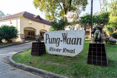 a sign that readsung woman river kent in front of a house at Pung-Waan Resort & Spa in Kanchanaburi