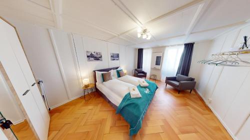 Postel nebo postele na pokoji v ubytování Zentral Altstadt Chur - Bahnhofsnah - Ferienwohnung - Bernina Express - Solution-Grischun