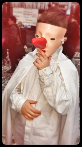 a toy boy with a red mask on his face at B&B Caprice d'Epices in Francorchamps