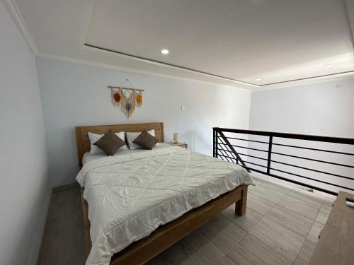 a bedroom with a bed in a room at Lajimbar Villa in Ketewel