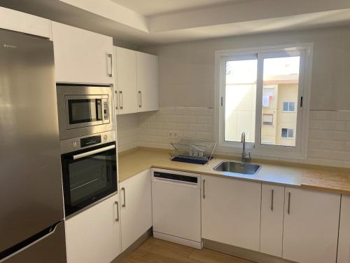 Η κουζίνα ή μικρή κουζίνα στο Cachucha Apartment