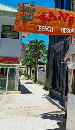 a sign for a beach resort on a street at Bans Boracay Island in Boracay