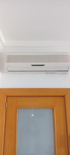 a air conditioner on a ceiling over a door at Quinta da Barracuda Prime Sea View Apartment in Albufeira