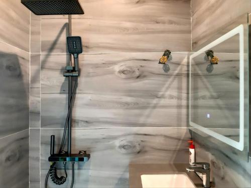 a bathroom with a white wall and a sink at Quang Minh Riverview Resort in Kroun