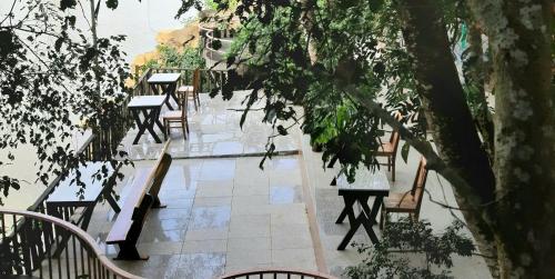 a row of tables and chairs on a patio at Quang Minh Riverview Resort in Kroun