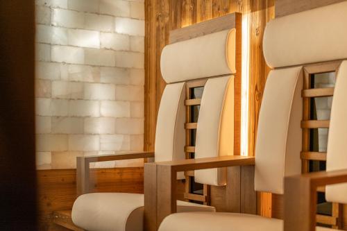a group of chairs sitting next to a window at Pension Wendlhof in Obergurgl