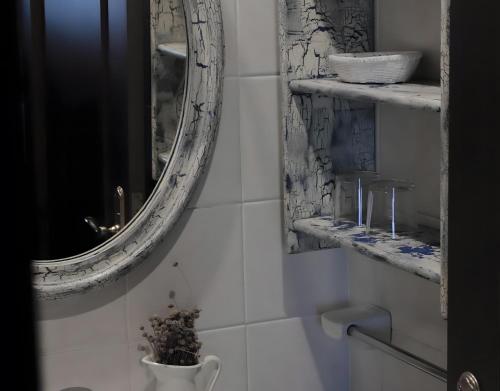 a bathroom with a mirror and a sink at Casa completa in Deba