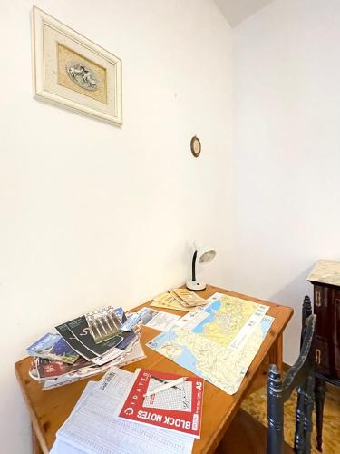 a table with a map and a lamp on it at Casa Gargiulo in Massa Lubrense