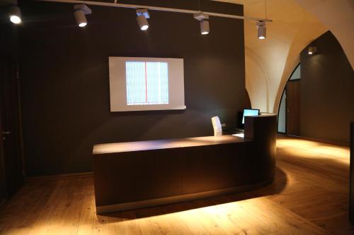 a black room with a counter with a window at Rothko Museum residences in Daugavpils