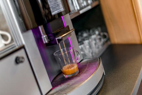 a drink in a blender sitting on a counter at Boutique Hotel KARL in Luzern