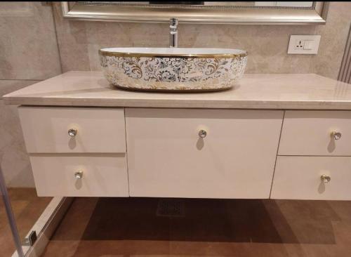 a bathroom counter with a sink on top of it at Teghs Hospitality - Entire Superior Villa Bungalow in Chandīgarh