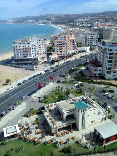 an aerial view of a city with a beach and buildings at Dar Omar Khayam in Tangier
