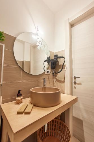 a bathroom with a sink and a mirror at Villa Vera in Salerno