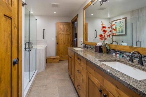 a bathroom with two sinks and a shower at Suncadia Trailhead 1 Pet Friendly Condo 203 in Cle Elum