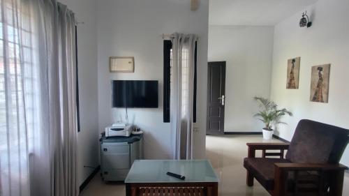 Televisyen dan/atau pusat hiburan di Kollamparampil Homestay