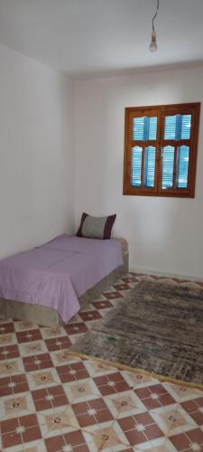 Katil atau katil-katil dalam bilik di maison Djerba