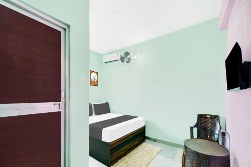 Ένα ή περισσότερα κρεβάτια σε δωμάτιο στο Hotel O R K RESIDENCY