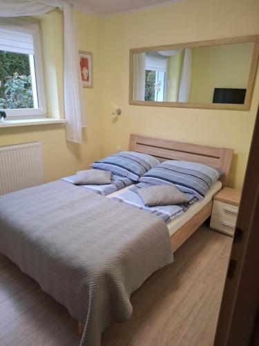 Posteľ alebo postele v izbe v ubytovaní APARTAMENT WŁODEK