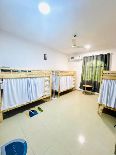 a hospital room with towels on the racks at Sukoon Hostel in Muscat
