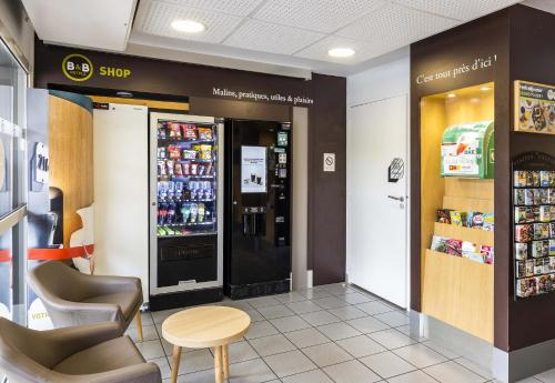 a store with a drink refrigerator in a store at B&B HOTEL Perpignan Sud Porte d'Espagne in Perpignan