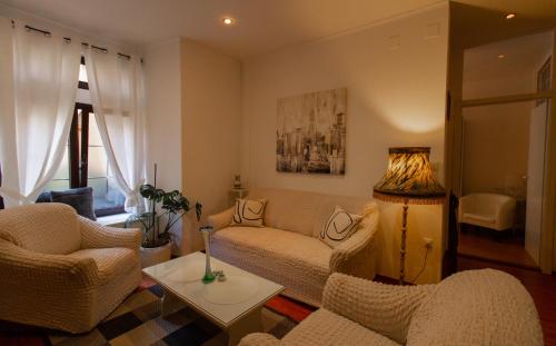 a living room with two chairs and a couch at B&B Apartments Coli Apatrman Viola Self check on the Ground floor in Bakar