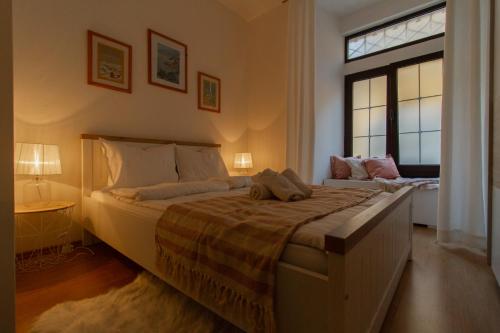 a bedroom with two beds and a window at B&B Apartments Coli Apatrman Viola Self check on the Ground floor in Bakar
