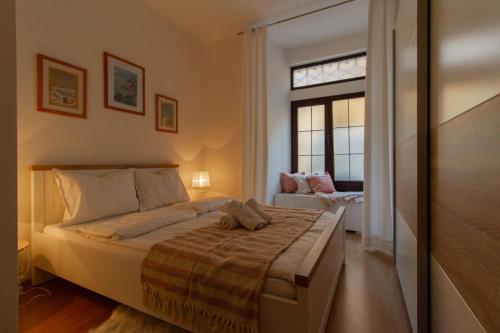 a bedroom with a bed and a window at B&B Apartments Coli Apatrman Viola Self check on the Ground floor in Bakar