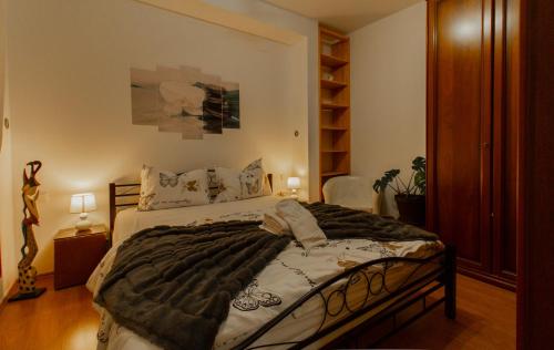 a bedroom with a large bed in a room at B&B Apartments Coli Apatrman Viola Self check on the Ground floor in Bakar