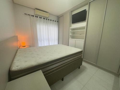 Ένα ή περισσότερα κρεβάτια σε δωμάτιο στο AP 2 Quartos no Centro do Passo de Torres