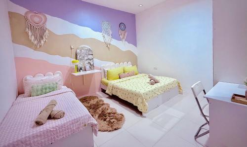 a childs bedroom with a bed and a couch at Mimi 1 Bedroom Studio House Homestay in Gerik