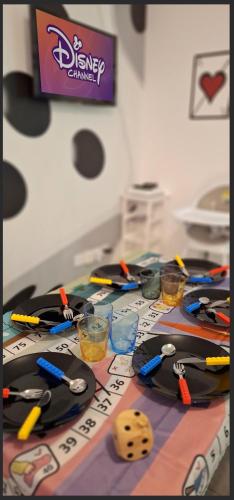 a table with scissors and other items on it at 15' de Disney maison à thème avec SALLE DE JEUX privée 6 couchages 2 wc in Voulangis