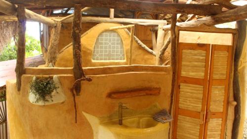 a bathroom in a house with a sink at Sol de Minca Eco Lodge in Minca