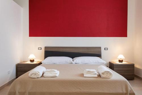 a bedroom with a bed with towels on it at Louis House ad Agerola per Amalfi Positano Pompei in Agerola
