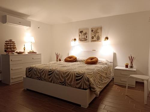 a bedroom with a bed with two pillows on it at La Mansarda in San Cesareo