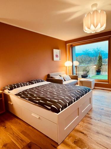 a bedroom with a large bed in a room at Casa Treveris II in Trier