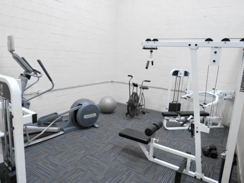 a fitness room with a gym with tread machines at Escape OBX in Kitty Hawk