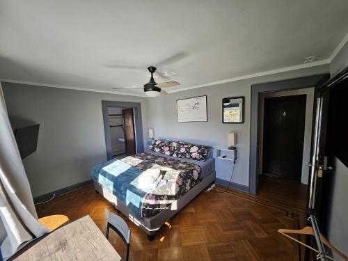 a bedroom with a bed and a ceiling fan at GuestHouse in Elizabeth