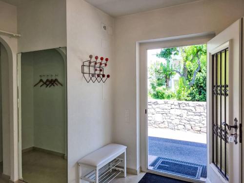 a hallway with a door leading to a yard at Holiday Home Villetta Isabella by Interhome in Ascona