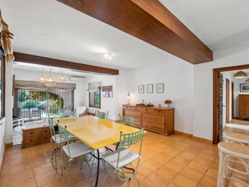 a dining room with a table and chairs at Villa La Familia by Interhome in Benissa