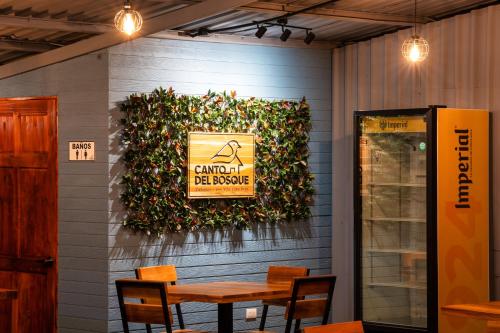 a dining room with a sign on a wall at Canto Del Bosque in San Vito